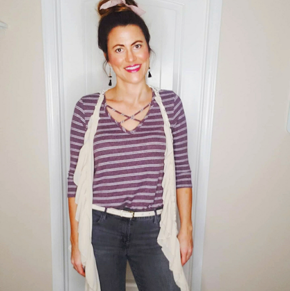 Soft striped top with crisscross neckline.